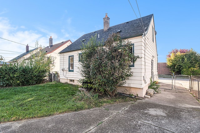 view of home's exterior featuring a yard