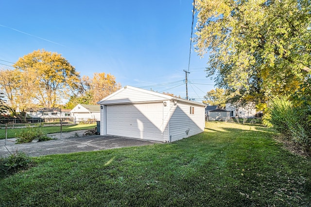 garage featuring a lawn