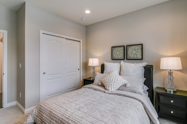 carpeted bedroom featuring a closet