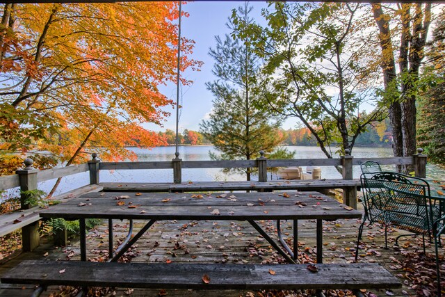 8918 W School Section Lake Dr, Mecosta, MI 49332 - view of yard featuring a deck with water view