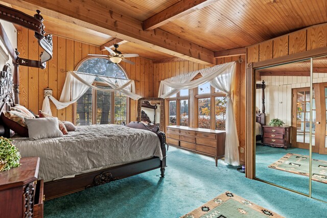 8918 W School Section Lake Dr, Mecosta, MI 49332 - bedroom featuring wood walls, carpet flooring, french doors, and wood ceiling with exposed beams