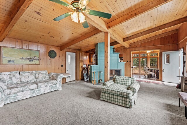8918 W School Section Lake Dr, Mecosta, MI 49332 - living area featuring wood walls, wooden ceiling, a fireplace, carpet flooring, and ceiling fan