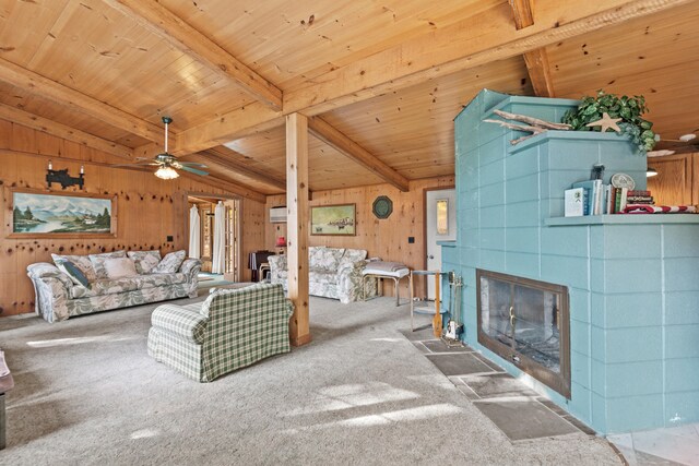 8918 W School Section Lake Dr, Mecosta, MI 49332 - carpeted living room featuring wood ceiling, wooden walls, a fireplace, and ceiling fan