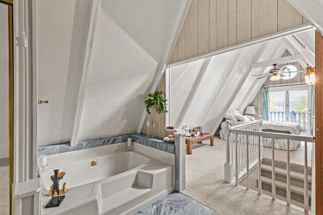 8918 W School Section Lake Dr, Mecosta, MI 49332 - ensuite bathroom featuring lofted ceiling and a bath