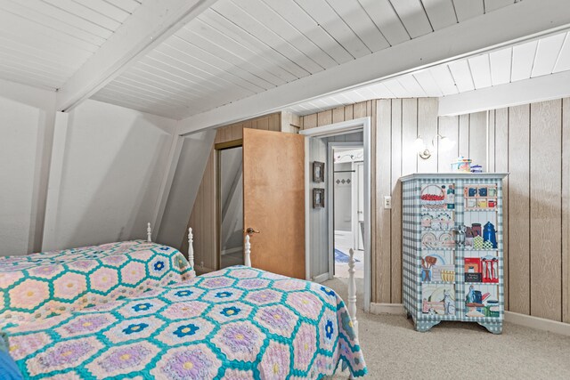 8918 W School Section Lake Dr, Mecosta, MI 49332 - carpeted bedroom featuring wood ceiling with exposed beams and wooden walls