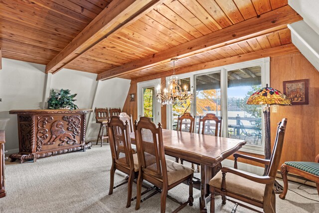 8918 W School Section Lake Dr, Mecosta, MI 49332 - carpeted dining area with a chandelier and wood ceiling with exposed beams