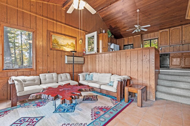8918 W School Section Lake Dr, Mecosta, MI 49332 - living room with ceiling fan, wooden ceiling, light tile patterned floors, lofted ceiling, and plenty of natural light