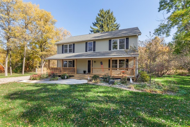 view of front of property with a front yard and a porch