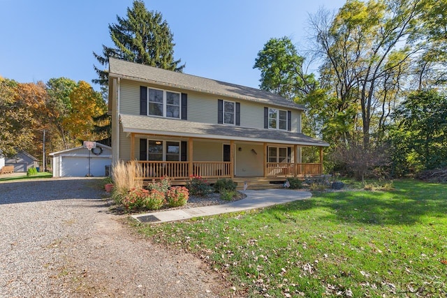 view of front of house featuring covered porch, a garage, an outdoor structure, and a front lawn