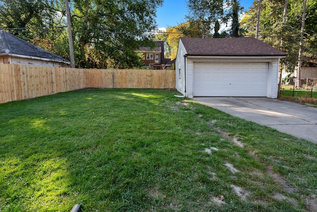 view of yard with a garage and an outdoor structure