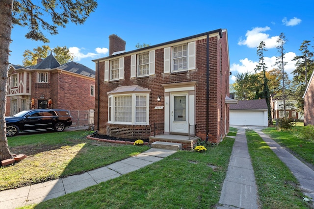 view of front of property with a front lawn and a garage