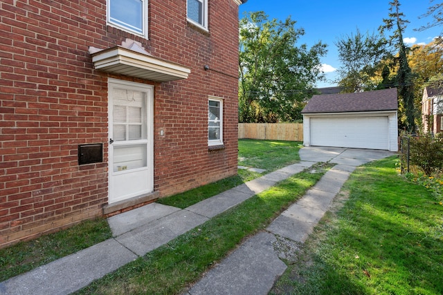 entrance to property featuring a lawn