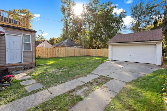 view of yard with an outbuilding and a garage