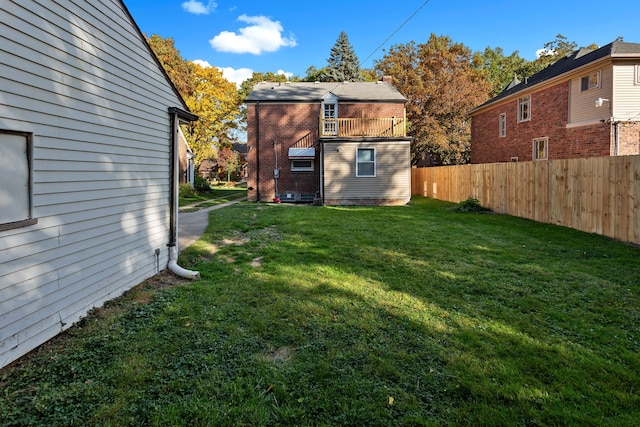 view of yard featuring a balcony