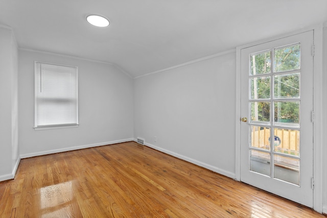 bonus room featuring light hardwood / wood-style floors and vaulted ceiling