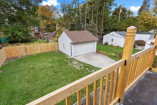 view of yard featuring a garage and an outbuilding