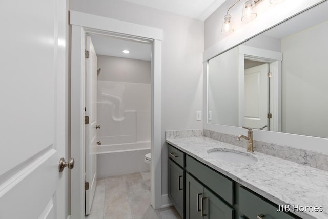 full bathroom with vanity, shower / tub combination, and toilet