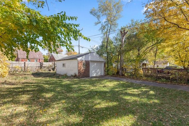 view of yard with a garage and an outdoor structure