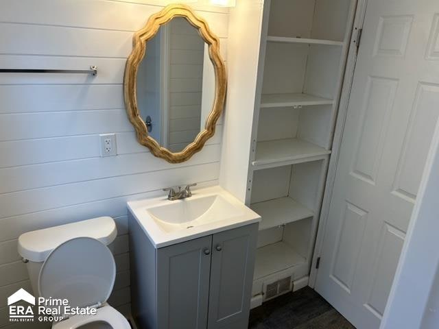 bathroom with vanity and toilet