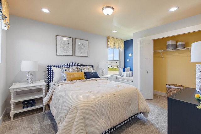 carpeted bedroom with a closet