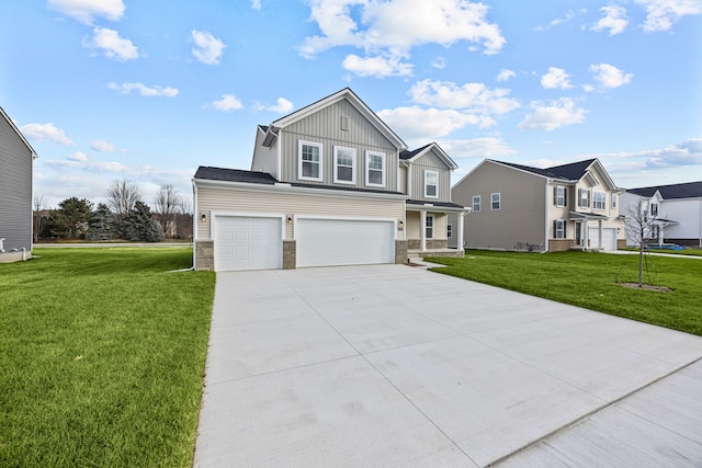 view of front of home featuring a front yard and a garage