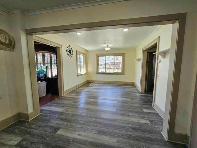 633 Marshall St, Allegan, MI 49010 - unfurnished dining area with ornamental molding, dark wood-style flooring, plenty of natural light, baseboards, and recessed lighting