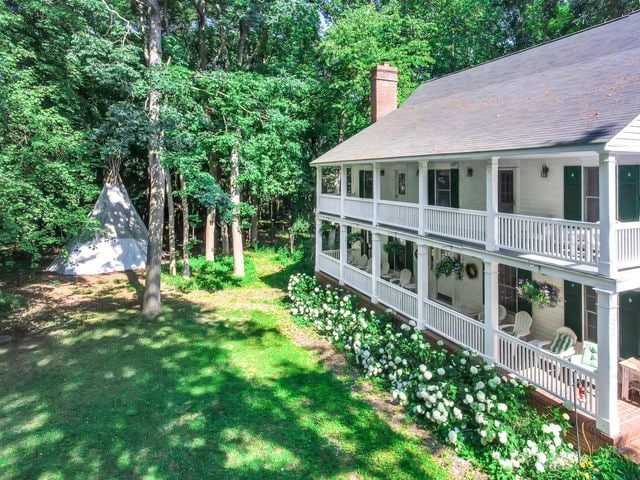 view of yard featuring a balcony