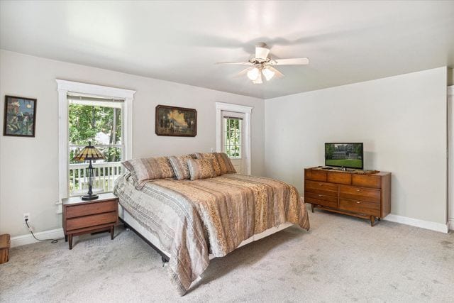 carpeted bedroom featuring ceiling fan