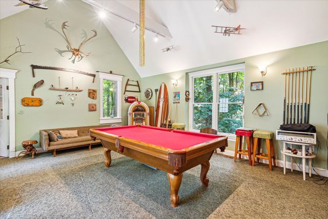 recreation room with carpet flooring, plenty of natural light, track lighting, and billiards