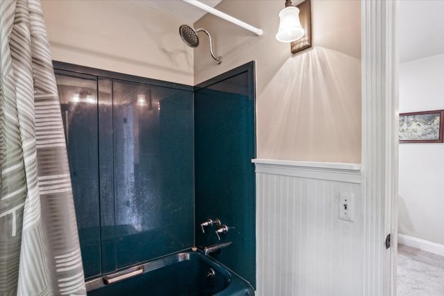 bathroom featuring bathing tub / shower combination