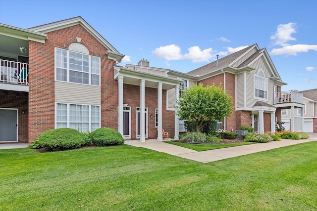 view of property featuring a front lawn