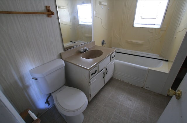 bathroom featuring plenty of natural light, vanity, and toilet