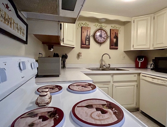 kitchen featuring light countertops, white appliances, a sink, and white cabinetry