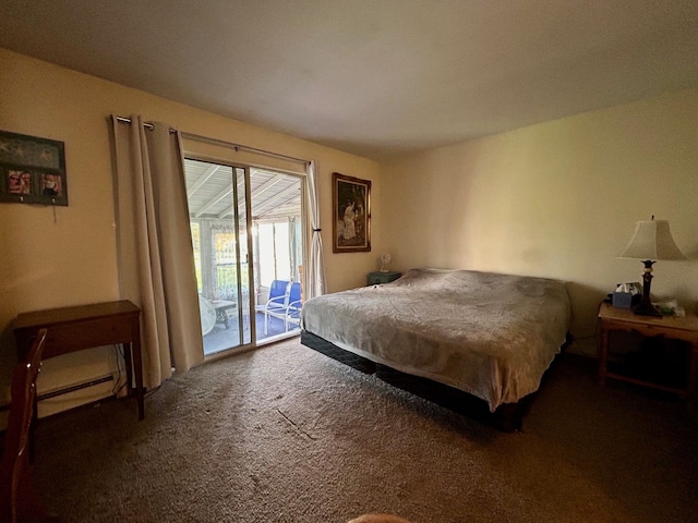 carpeted bedroom featuring access to exterior