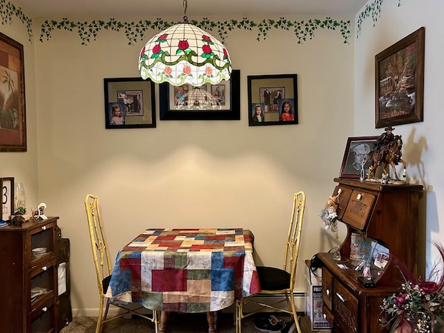 view of carpeted dining area