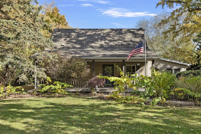 view of front facade with a front yard and a porch