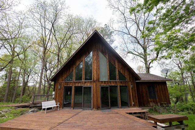 6020 Clark Rd, Bath, MI 48808 - rear view of property with a wooden deck