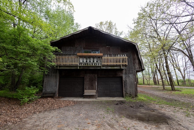 6020 Clark Rd, Bath, MI 48808 - view of front of house with driveway and a garage