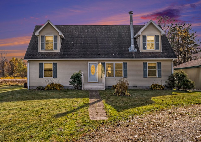 cape cod home with a lawn