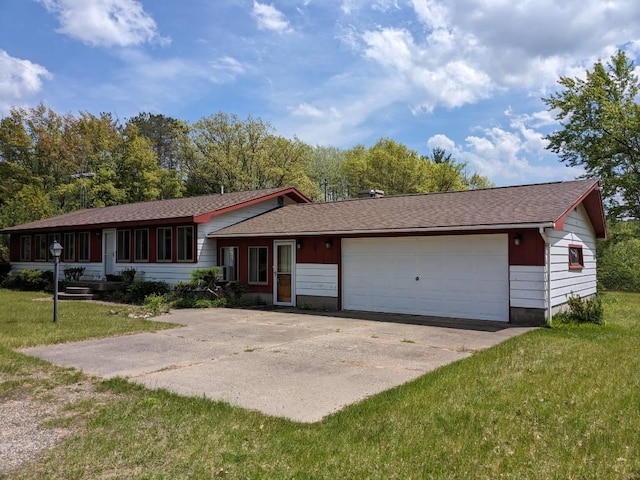 ranch-style home with a front yard and a garage