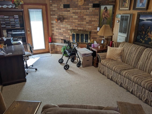 carpeted living room with a brick fireplace