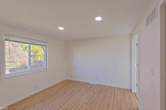 spare room with light wood-type flooring