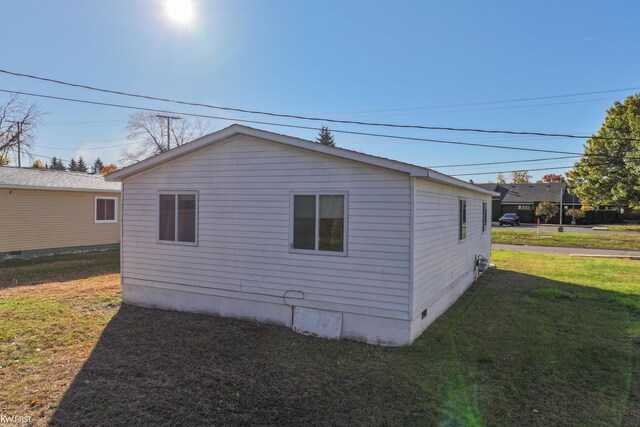 view of property exterior featuring a yard