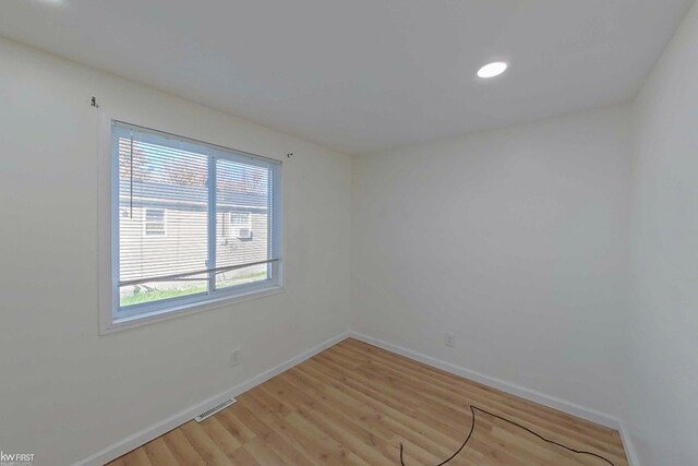 unfurnished room featuring light hardwood / wood-style flooring and a wealth of natural light