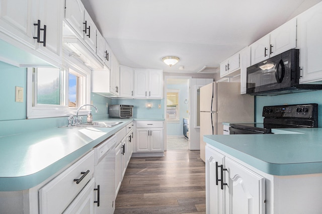 kitchen featuring black appliances, dark hardwood / wood-style flooring, white cabinets, and sink