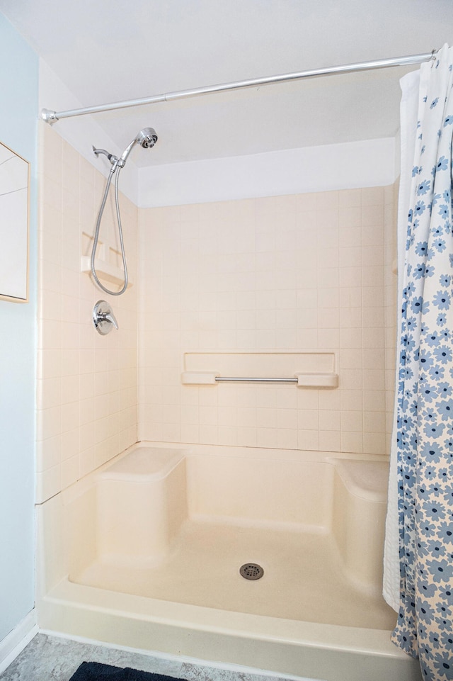 bathroom with a shower with curtain