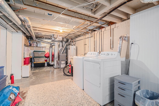 basement featuring washer and dryer and gas water heater