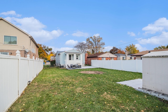 view of yard featuring a patio and a storage shed