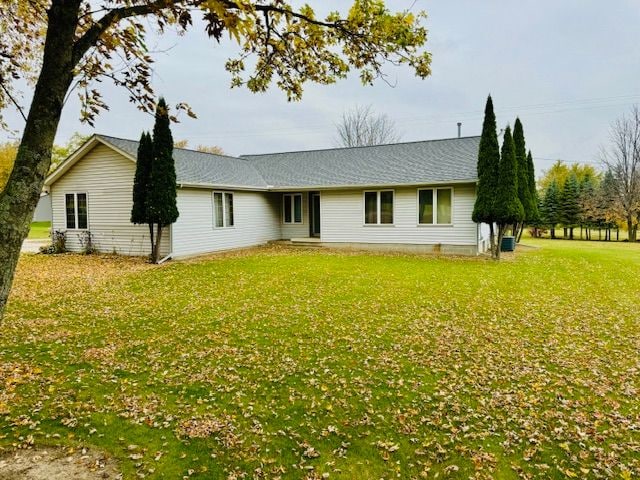 view of front of property with a front lawn