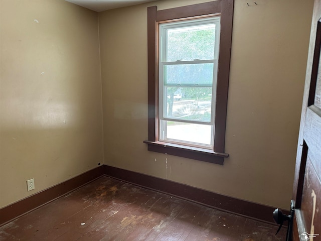 spare room featuring dark hardwood / wood-style floors